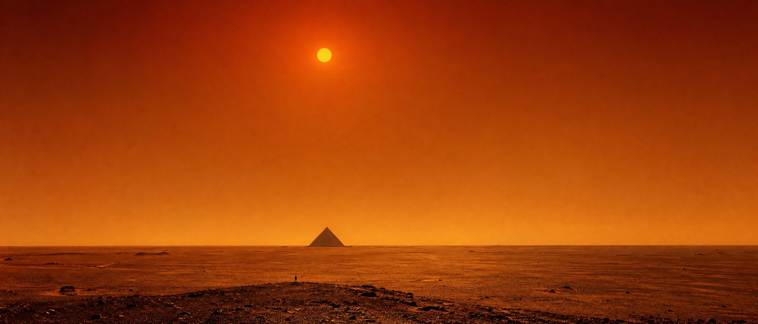 A colossal black pyramid standing alone on a distant desert horizon under a burnt orange sky.